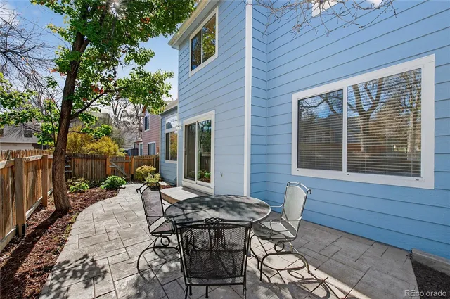 a picture of a room with a bench and a picture