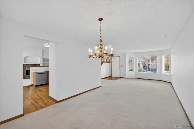 a kitchen with stainless steel appliances a refrigerator and a sink