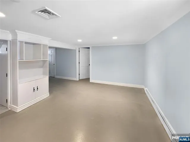 a view of patio with furniture and fireplace