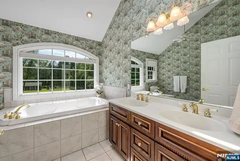 a bathroom with a sink and a large mirror
