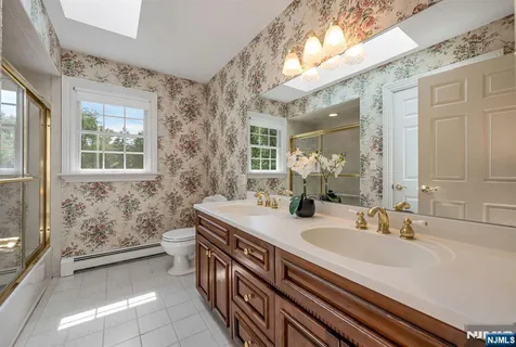 a bathroom with a sink a vanity and a mirror