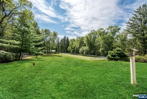 a view of field with trees in the background