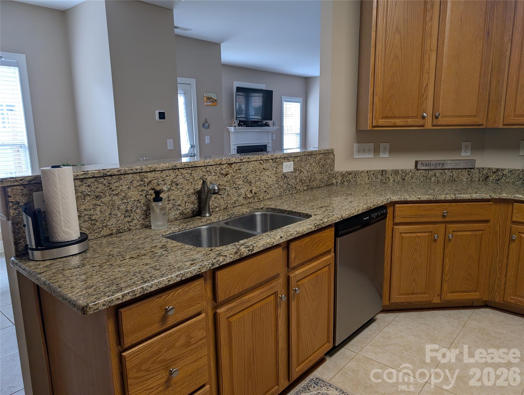 20207 Colony Point Lane Cornelius, NC 28031 - Photo 11 of 26 a kitchen with stainless steel appliances granite countertop a sink and cabinets