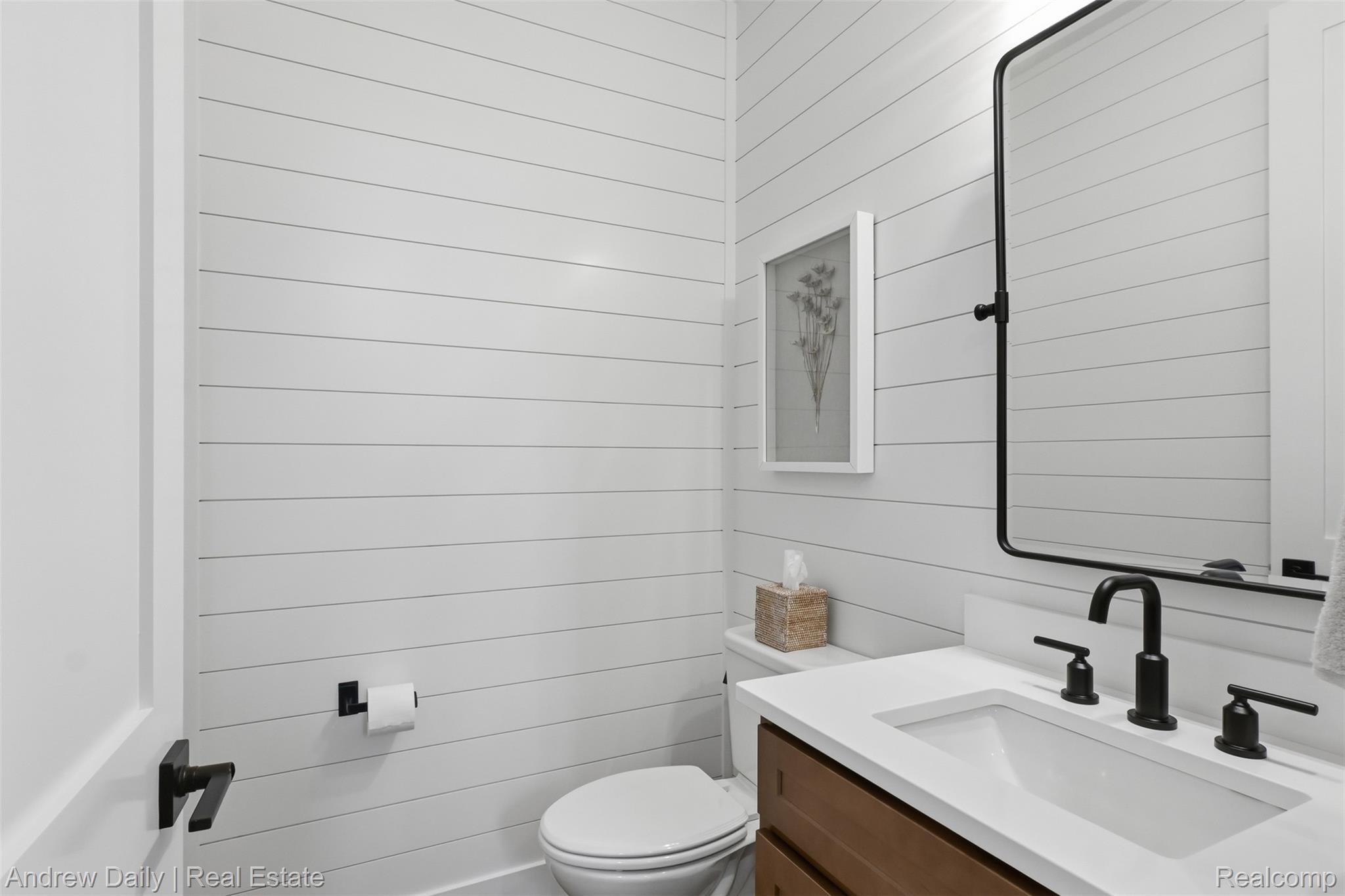 4661 Spears Road Pinckney, MI 48169 - Photo 11 of 56 Bathroom featuring shiplap walls, a rectangular undermount sink, white countertop, and dark wood-finish vanity