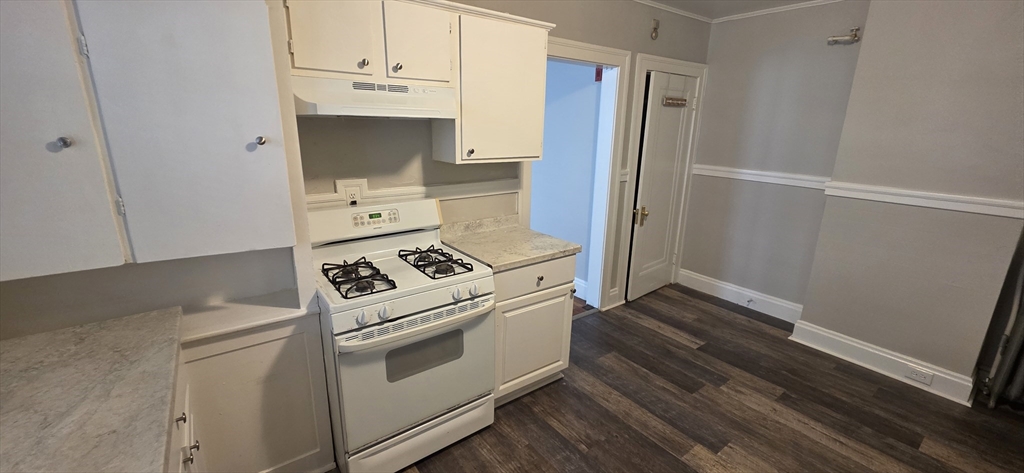 33 Harbor Street, Unit 1R Salem, MA 01970 - Photo 3 of 9 a kitchen with a stove and a refrigerator