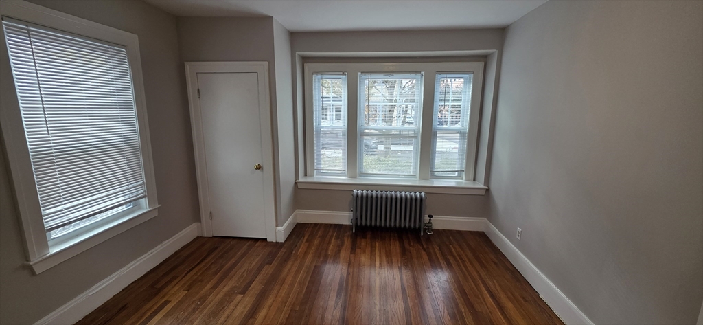 33 Harbor Street, Unit 1R Salem, MA 01970 - Photo 4 of 9 a view of a room with wooden floor and balcony