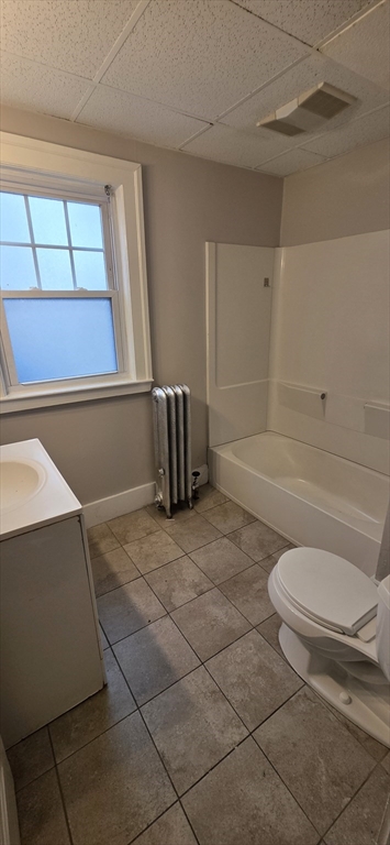 33 Harbor Street, Unit 1R Salem, MA 01970 - Photo 8 of 9 a bathroom with a toilet and a bathtub