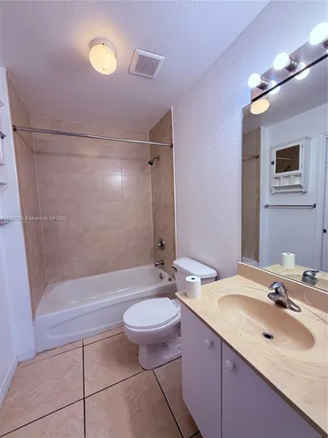 a view of a livingroom with a lounge chair