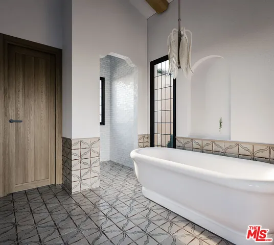 a spacious bathroom with a bathtub and a sink