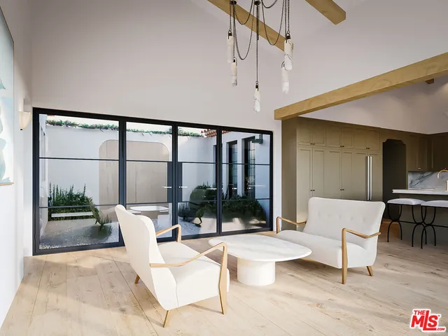 a living room with furniture a table and a large window