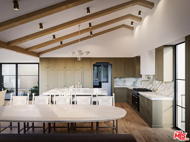 a kitchen with a table chairs stove and refrigerator