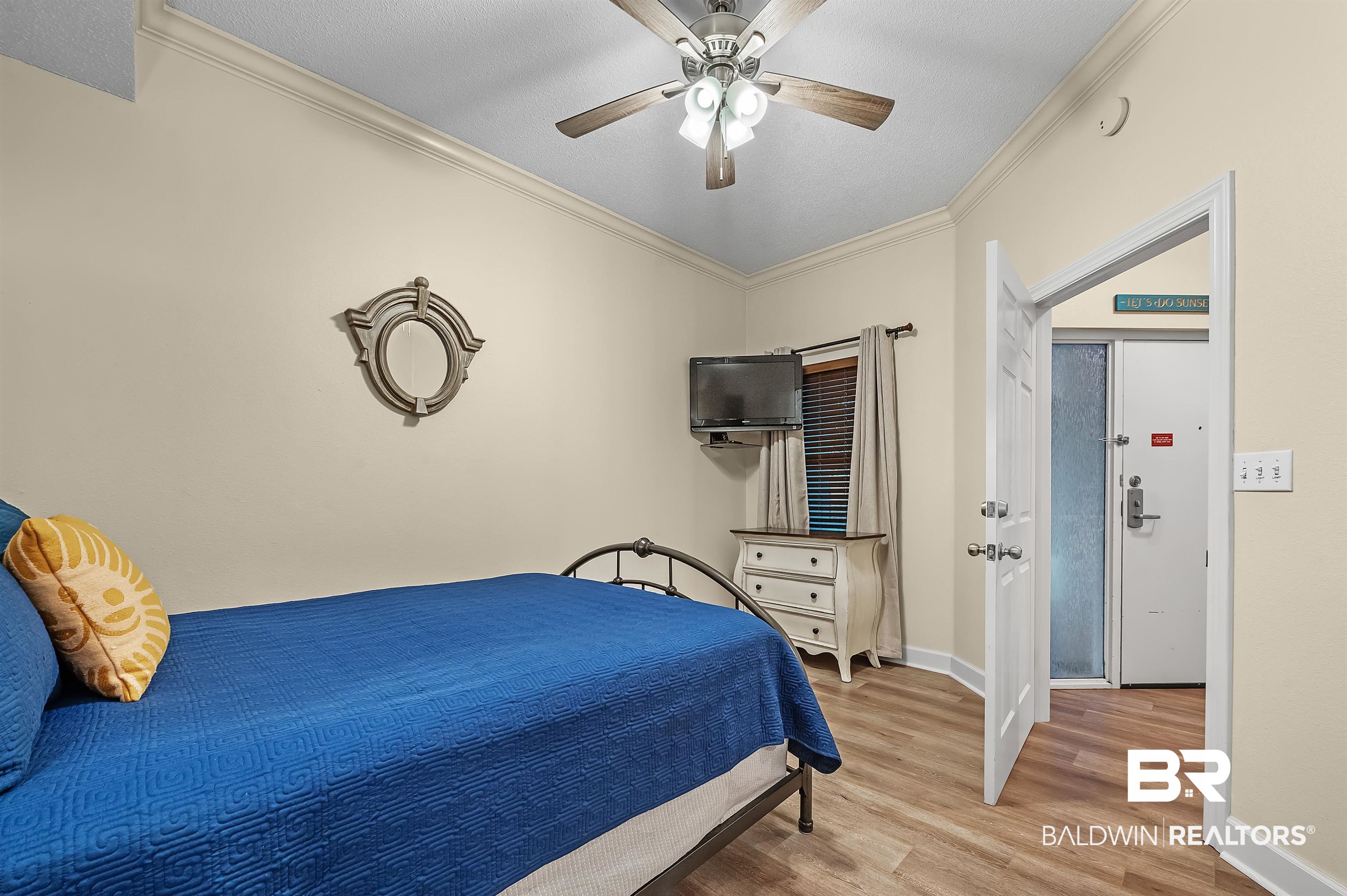 27582 Canal Road, Unit 2104 Orange Beach, AL 36561 - Photo 28 of 35 Bedroom featuring ceiling fan, ornamental molding, and light hardwood / wood-style floors