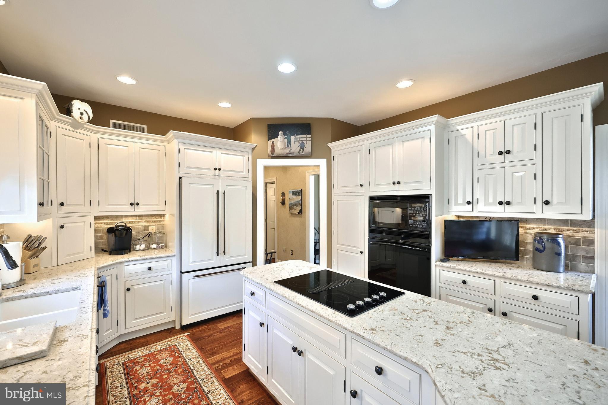 245 Orchard Drive Hanover, PA 17331 - Photo 12 of 78 a kitchen with white cabinets and stainless steel appliances