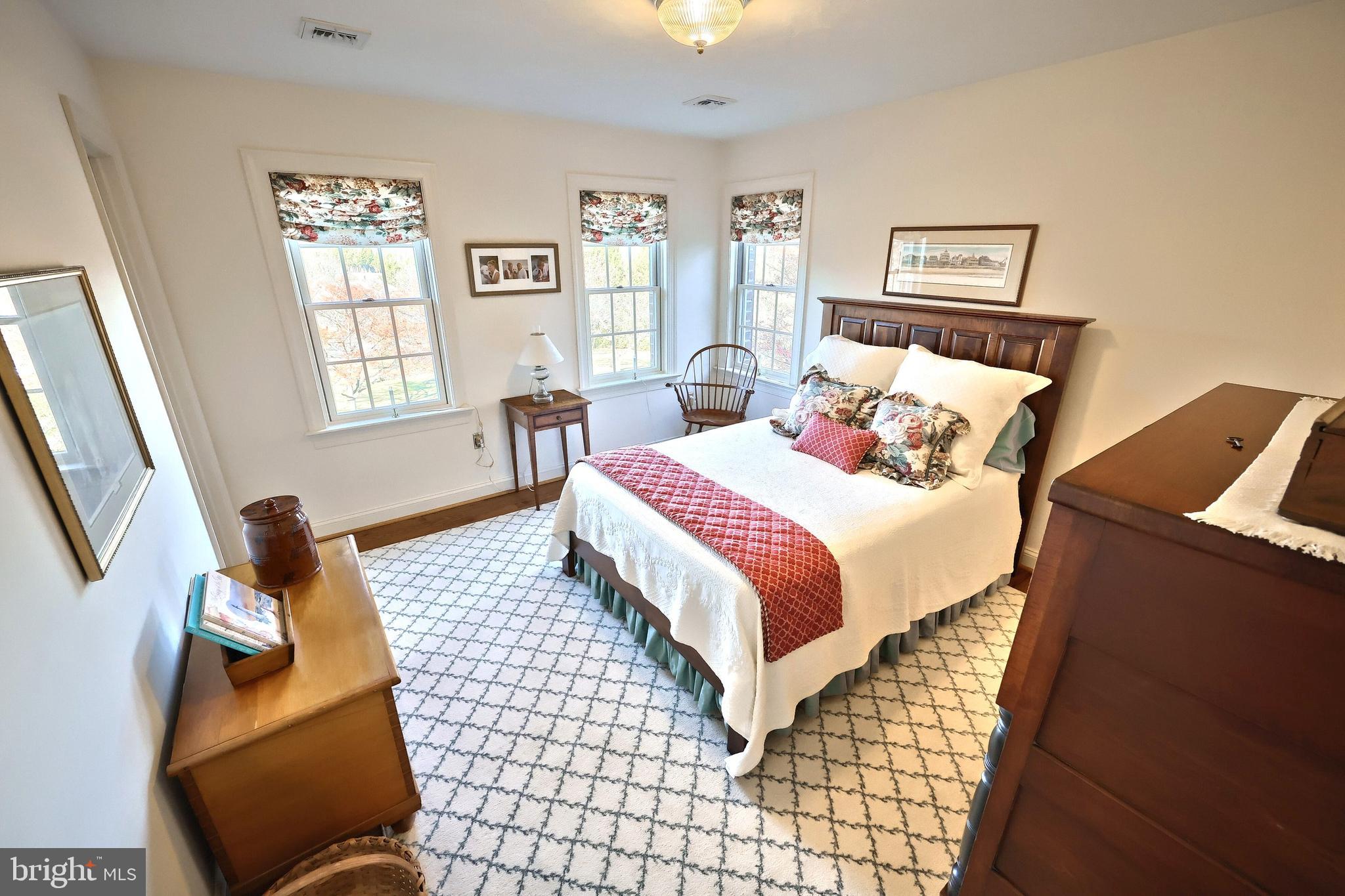 245 Orchard Drive Hanover, PA 17331 - Photo 39 of 78 a bedroom with a bed and wooden floor