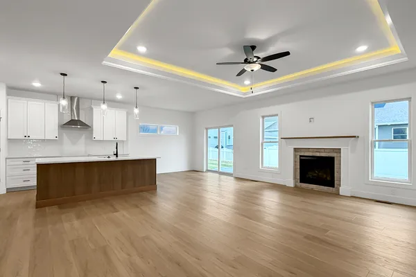 a view of kitchen with sink and window