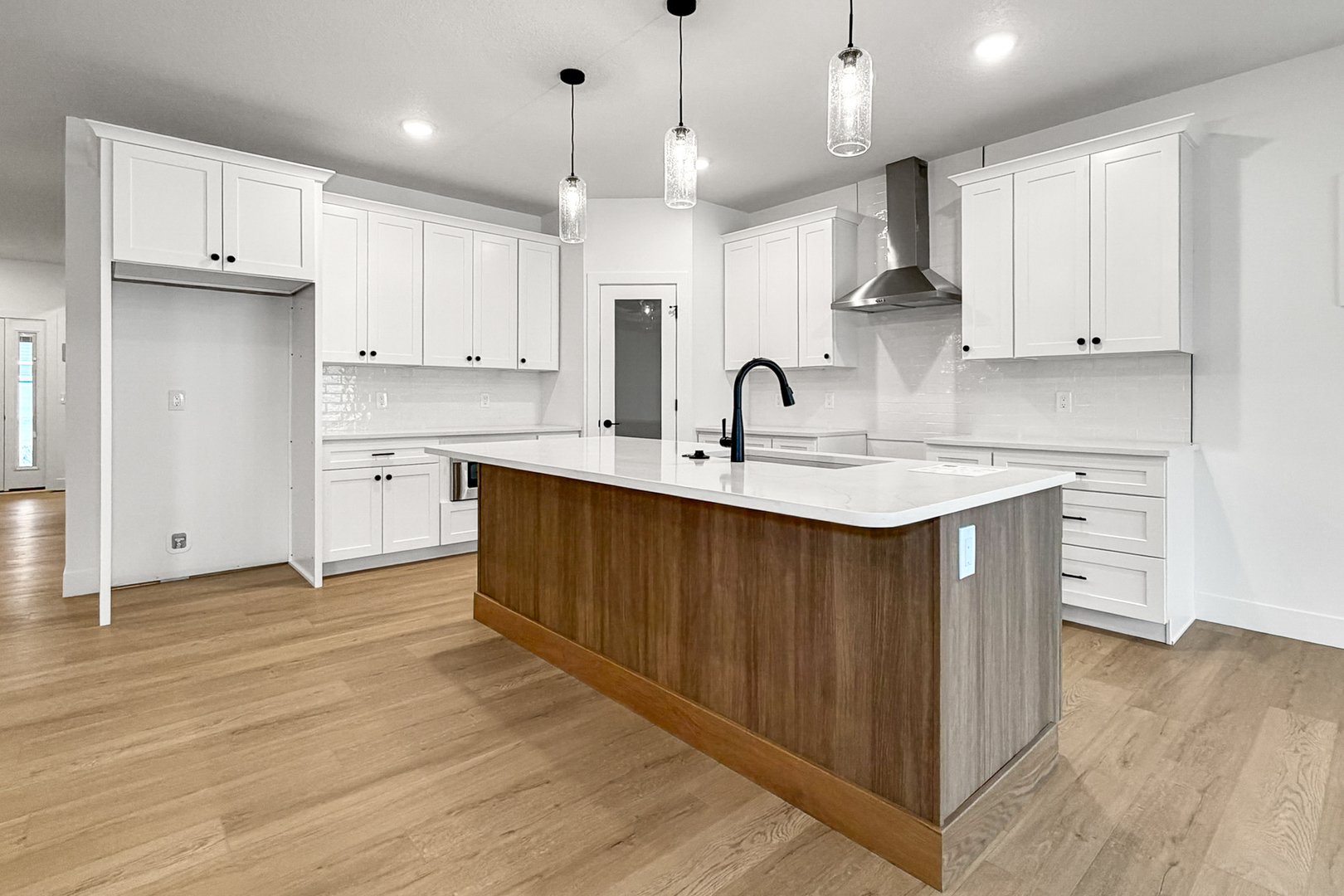 606 Kevin Road Blue Grass, IA 52726 - Photo 21 of 33 a kitchen with kitchen island a sink stainless steel appliances and cabinets