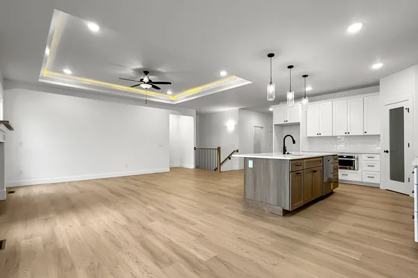 a large kitchen with kitchen island a island in the center