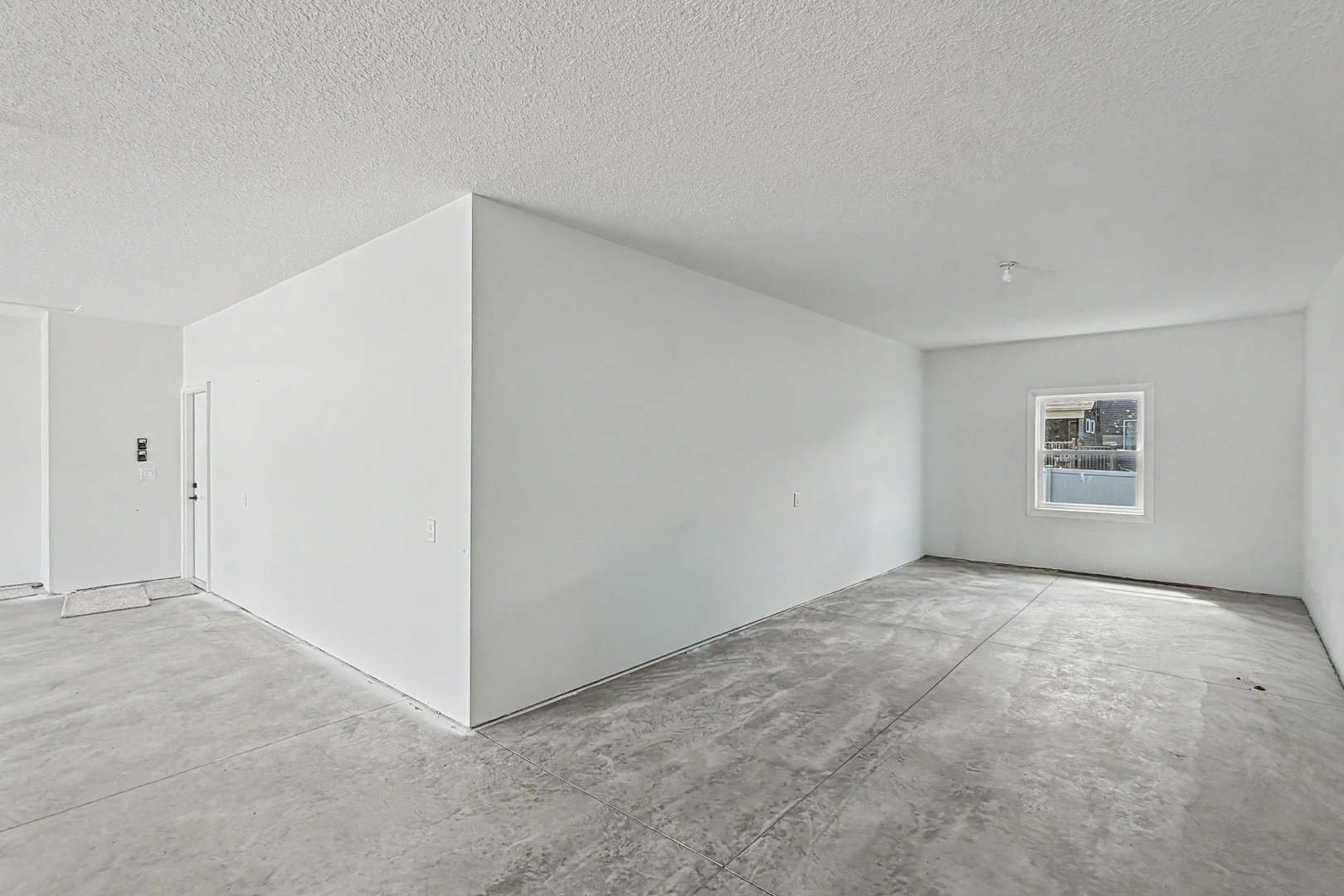606 Kevin Road Blue Grass, IA 52726 - Photo 4 of 33 an empty room with windows