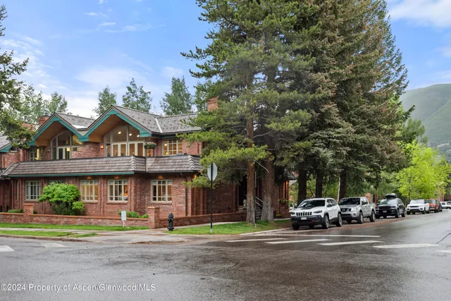 a view of street with parked cars