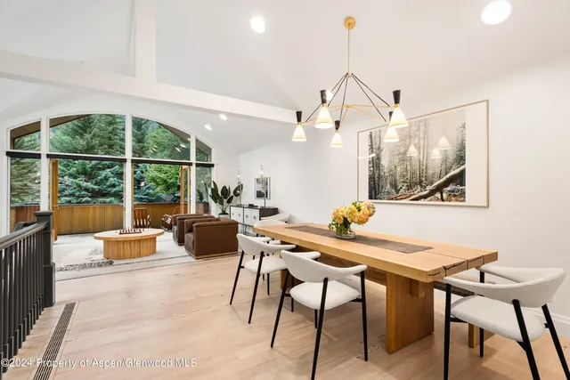 a view of a dining room with furniture window and outside view