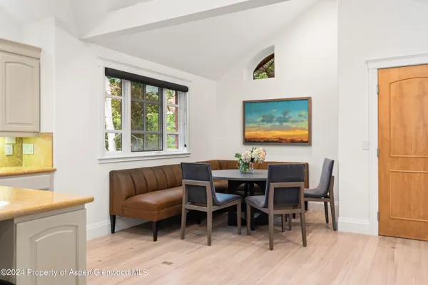 a view of a dining room with furniture window and wooden floor