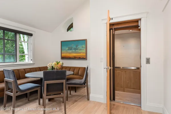 a dining room with furniture and window