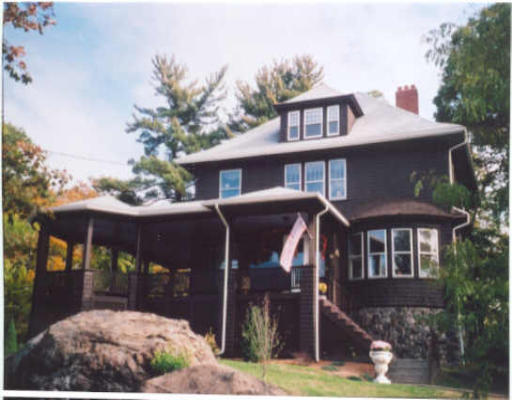 49 Renwick Road Wakefield, MA 01880 - Photo 1 of 1 a front view of a house with yard and glass windows