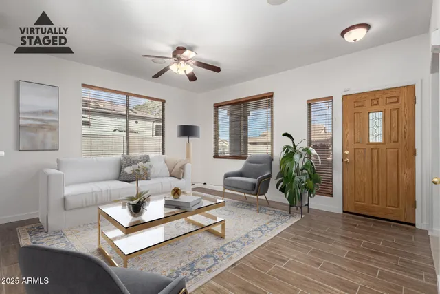 a view of livingroom with furniture fireplace and workspace