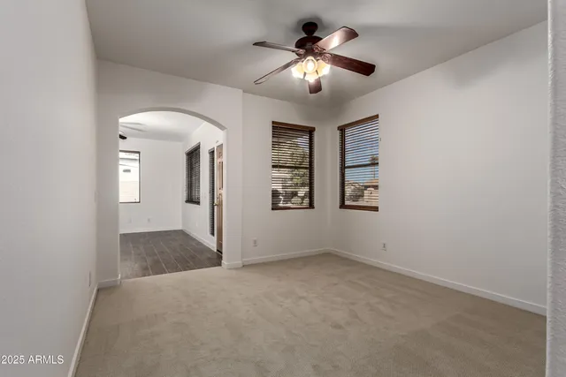 a kitchen with kitchen island granite countertop a stove and a refrigerator