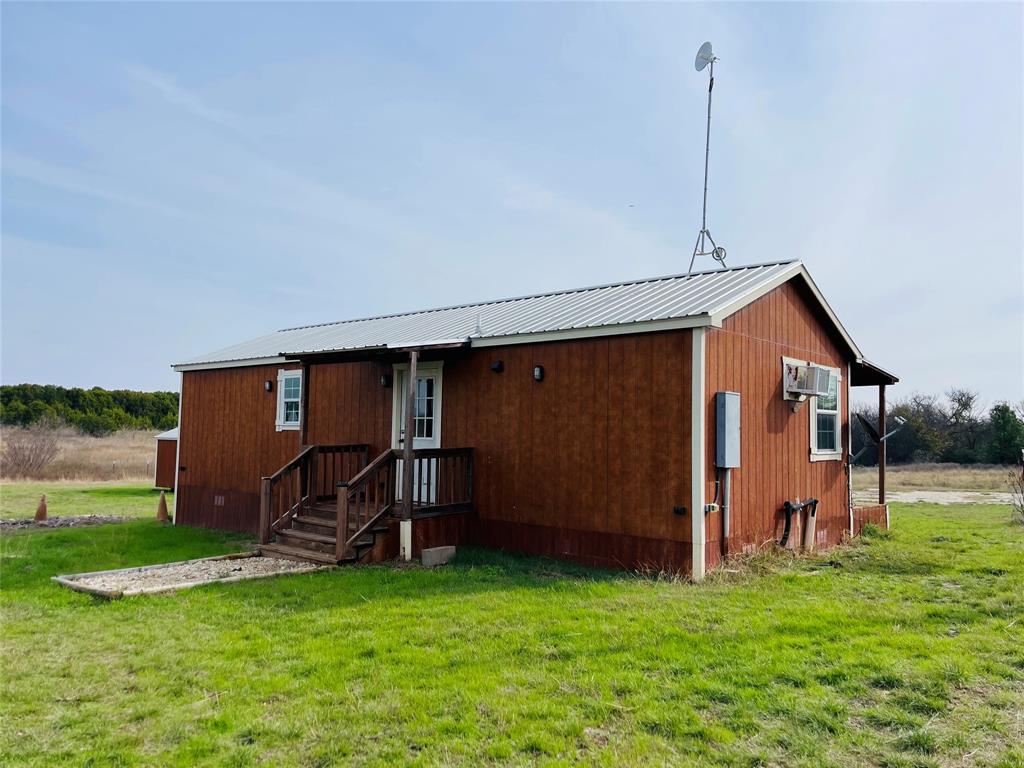 214 Cedar Creek Park Road Whitney, TX 76692 - Photo 26 of 32 a front view of a house with garden