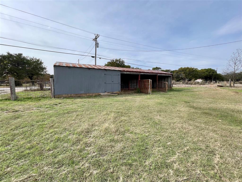 214 Cedar Creek Park Road Whitney, TX 76692 - Photo 31 of 32 a view of a house with a yard
