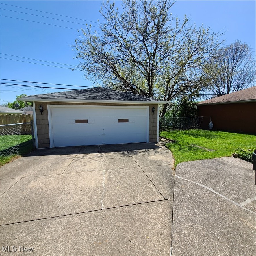 12204 Grannis Road Garfield Heights, OH 44125 - Photo 21 of 22 Property features two car detached garage with automatic door opener