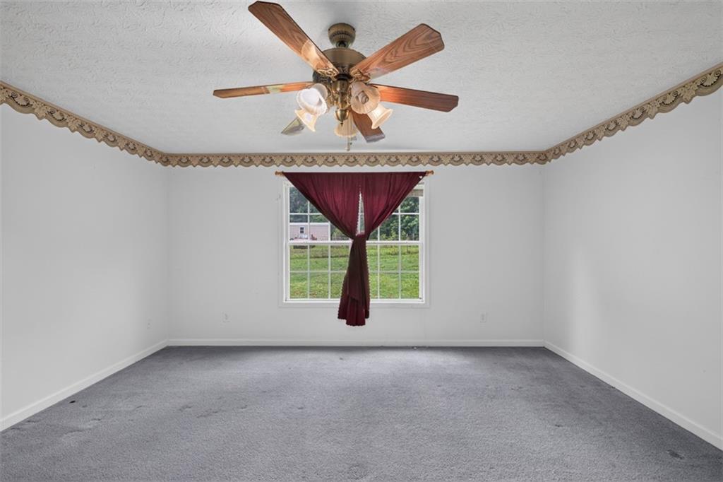 602 Pendergrass Road Winder, GA 30680 - Photo 21 of 44 a view of an empty room with a window