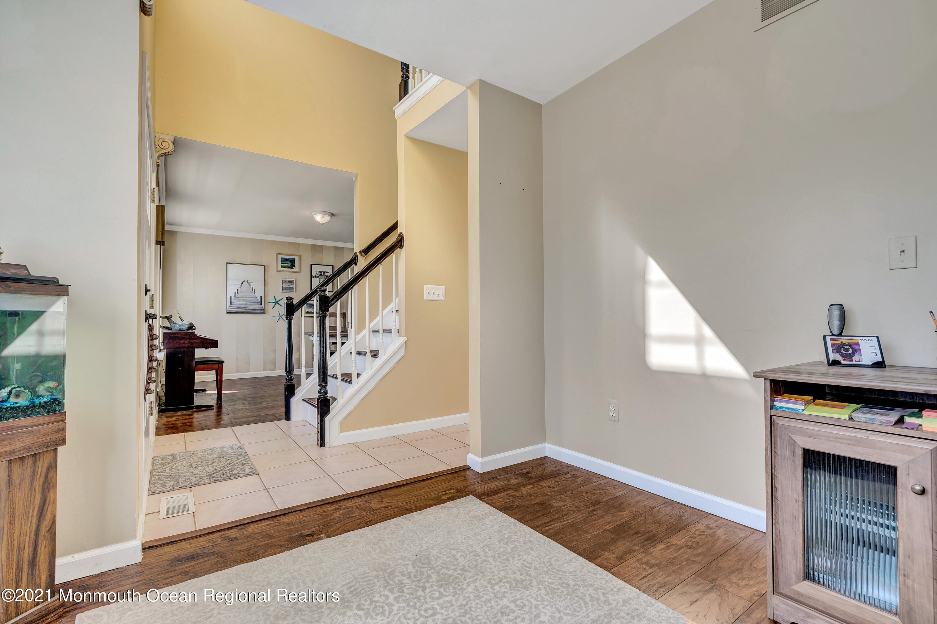 101 Longboat Road Manahawkin, NJ 08050 - Photo 12 of 47 a view of entryway and hall with wooden floor