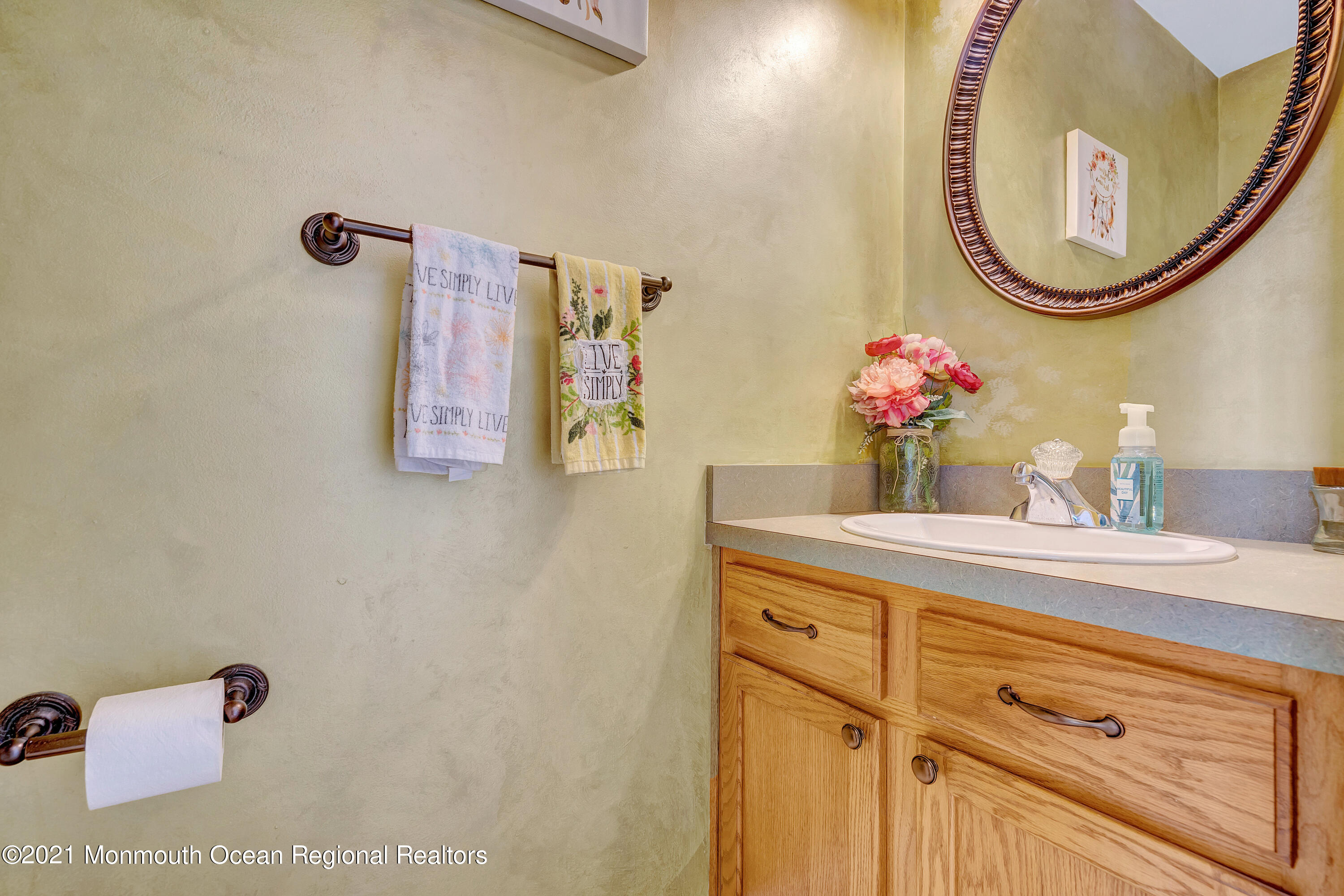 101 Longboat Road Manahawkin, NJ 08050 - Photo 13 of 47 a bathroom with a sink mirror and vanity