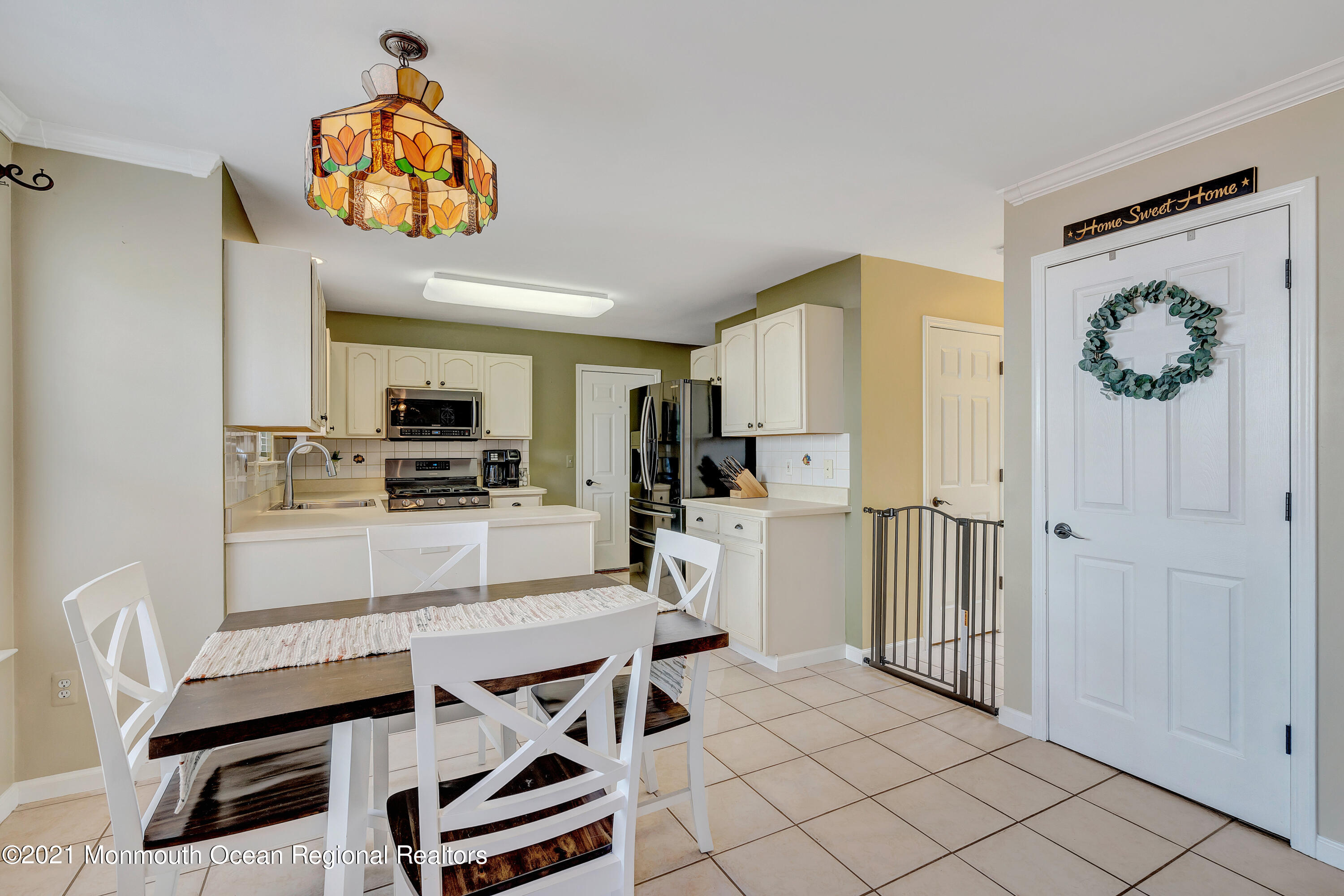 101 Longboat Road Manahawkin, NJ 08050 - Photo 15 of 47 a kitchen with stainless steel appliances a refrigerator and a stove top oven