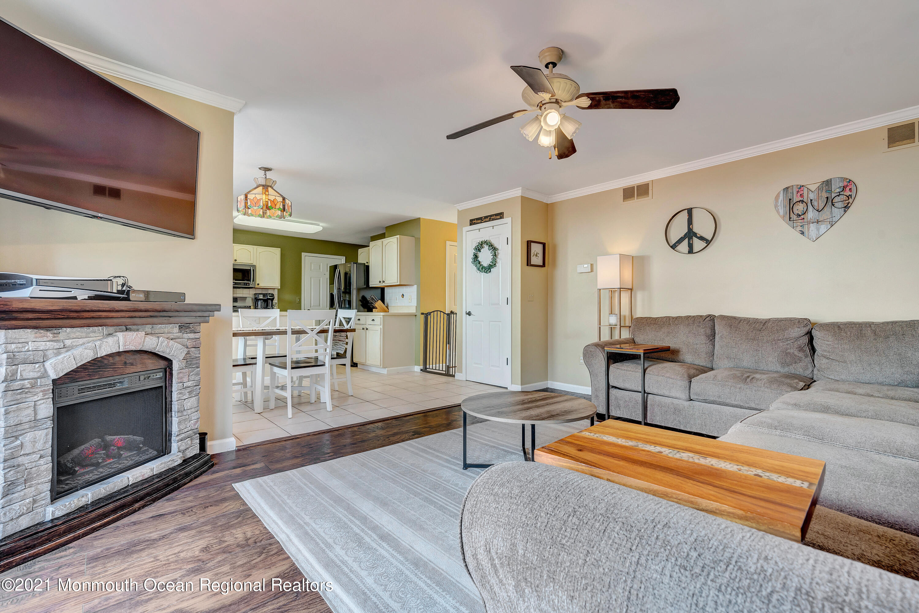 101 Longboat Road Manahawkin, NJ 08050 - Photo 24 of 47 a living room with furniture and a fireplace