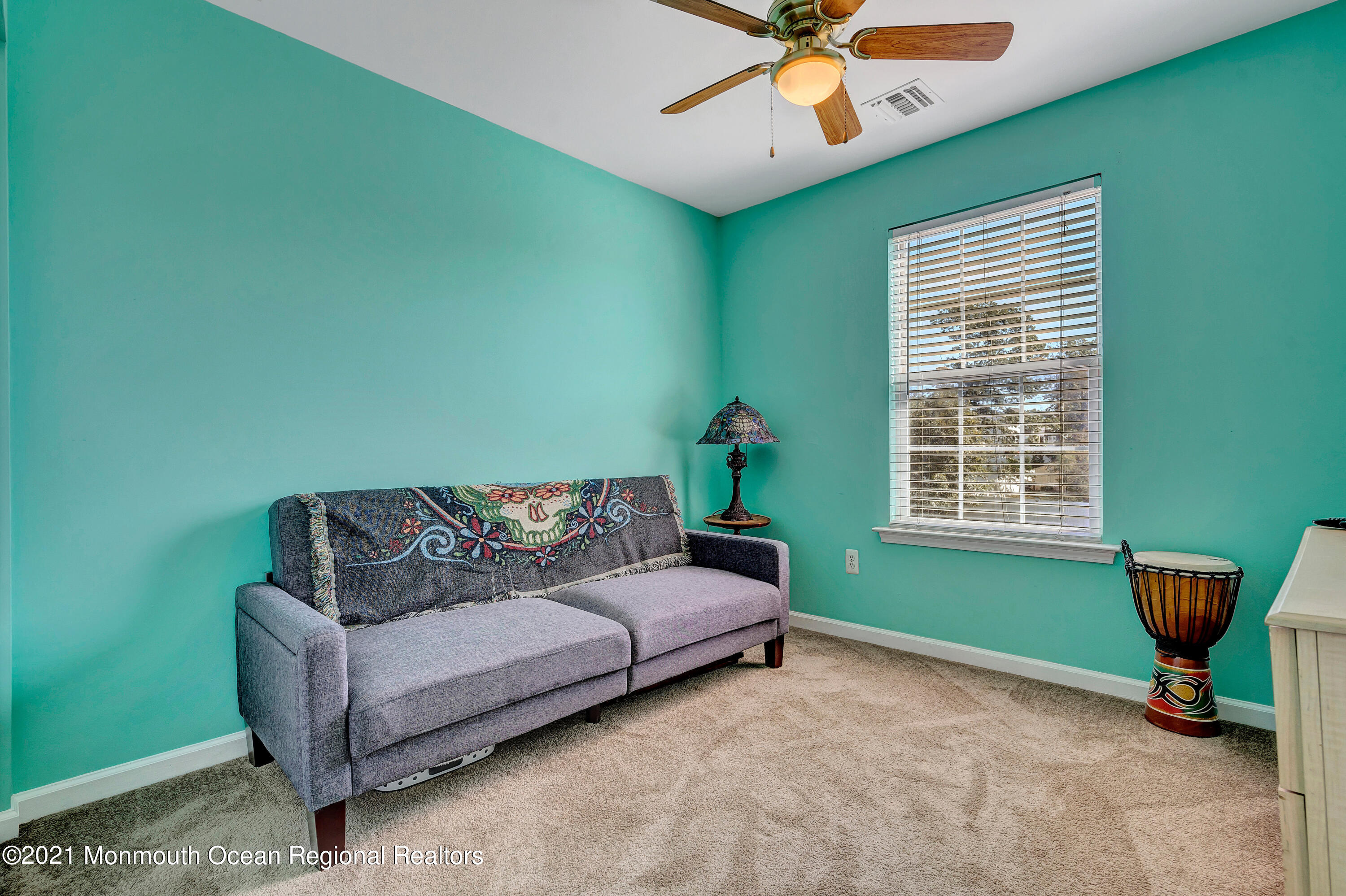 101 Longboat Road Manahawkin, NJ 08050 - Photo 31 of 47 a living room with furniture and a window