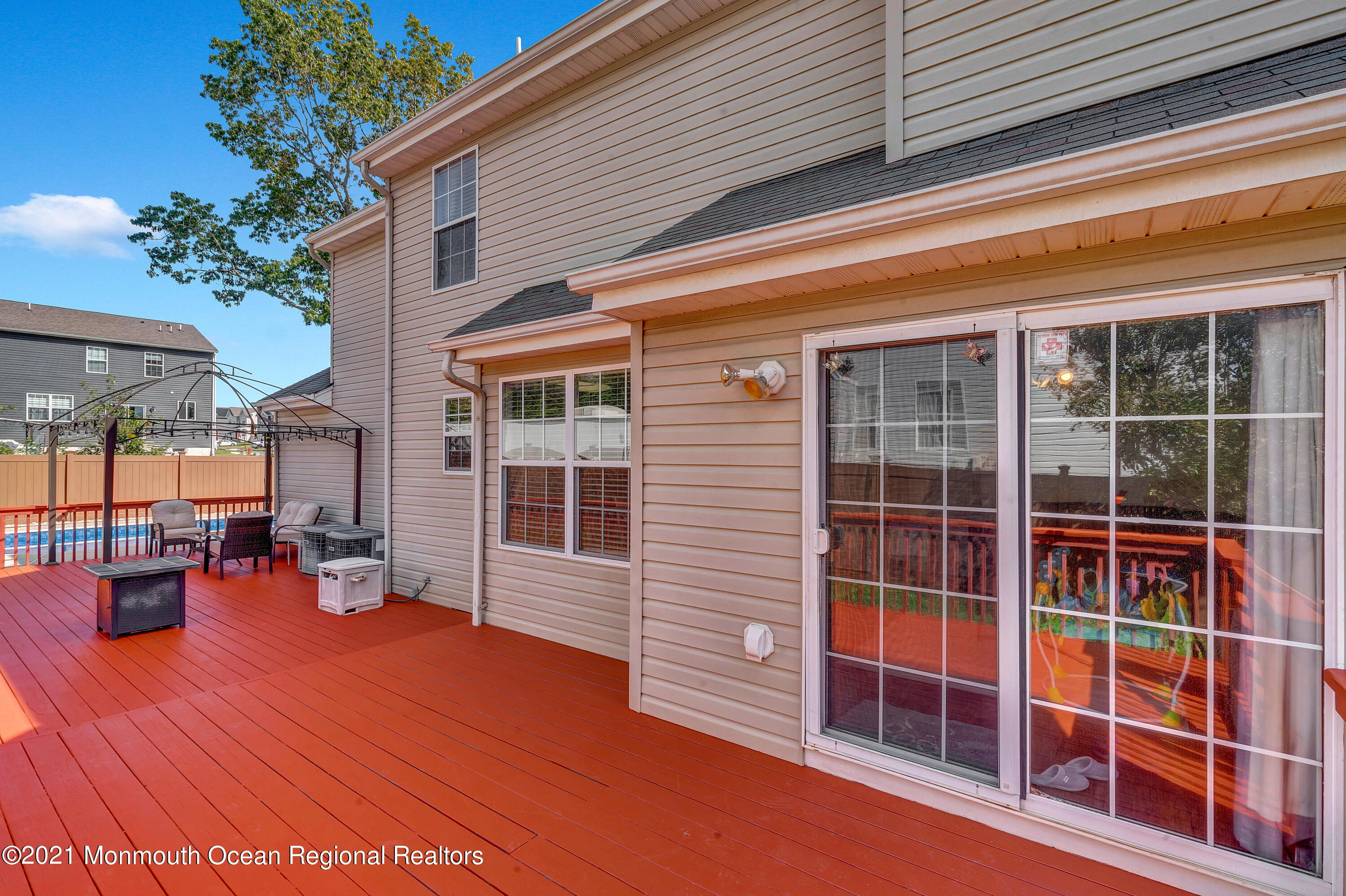 101 Longboat Road Manahawkin, NJ 08050 - Photo 33 of 47 a view of outdoor space with wooden floor and plants