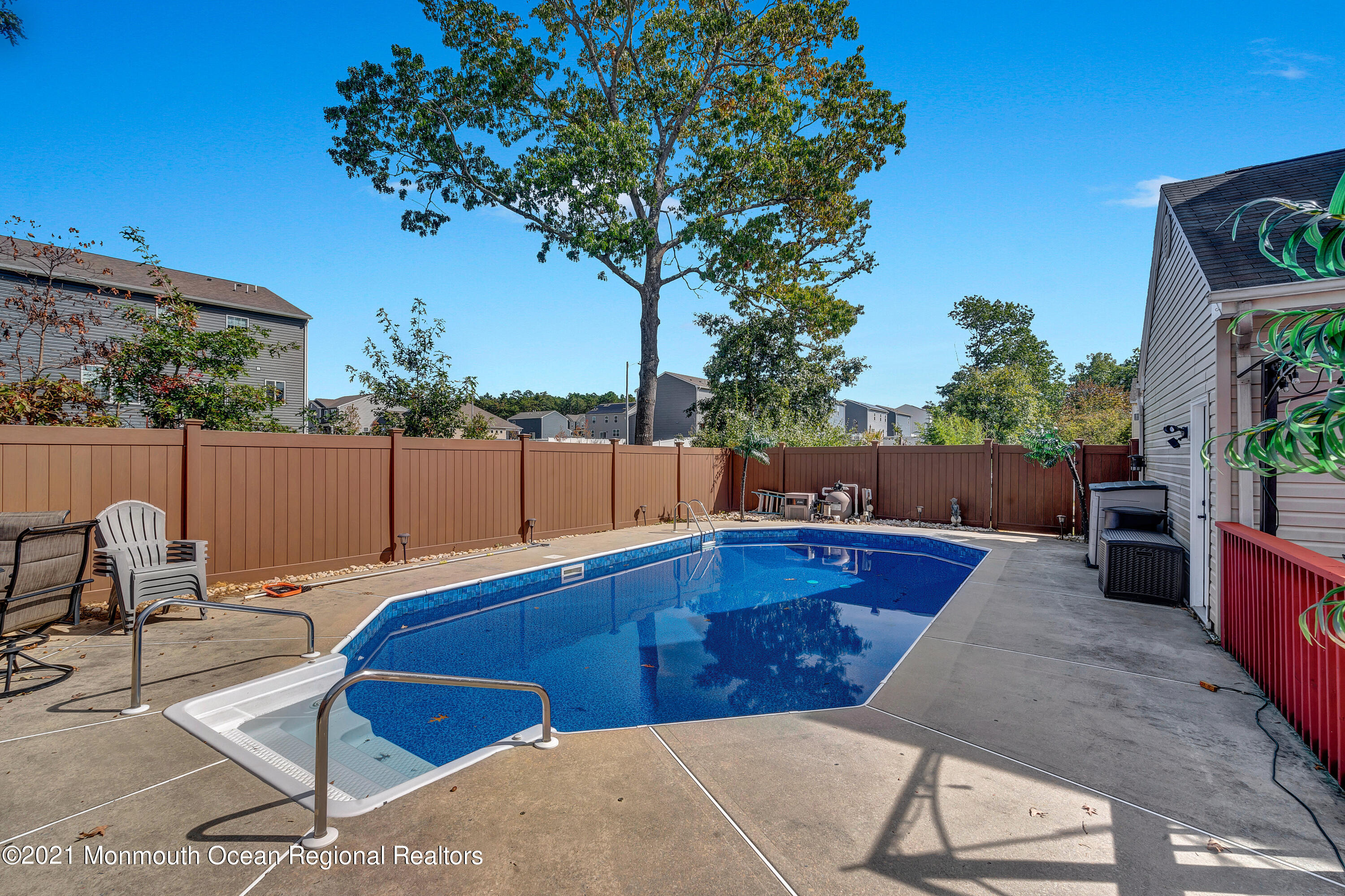 101 Longboat Road Manahawkin, NJ 08050 - Photo 35 of 47 a view of a backyard with swimming pool