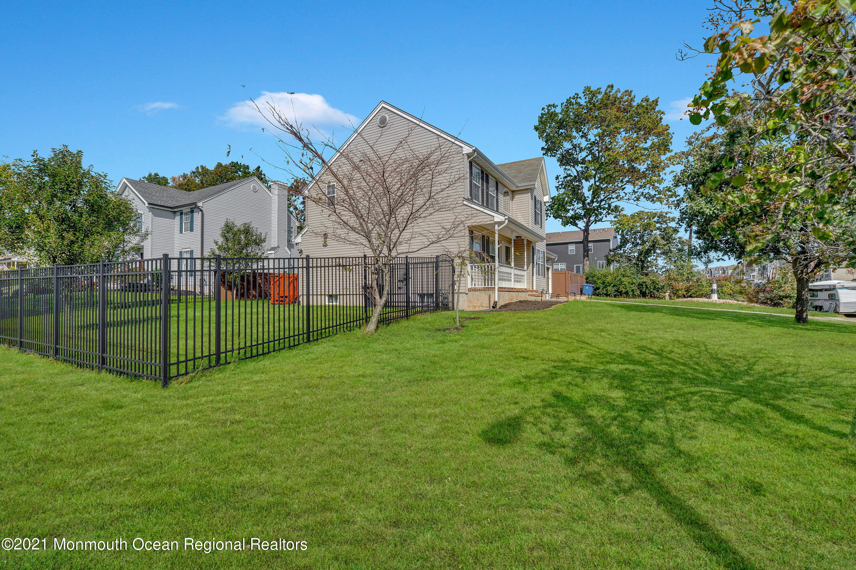 101 Longboat Road Manahawkin, NJ 08050 - Photo 38 of 47 a view of a house with a big yard and large trees