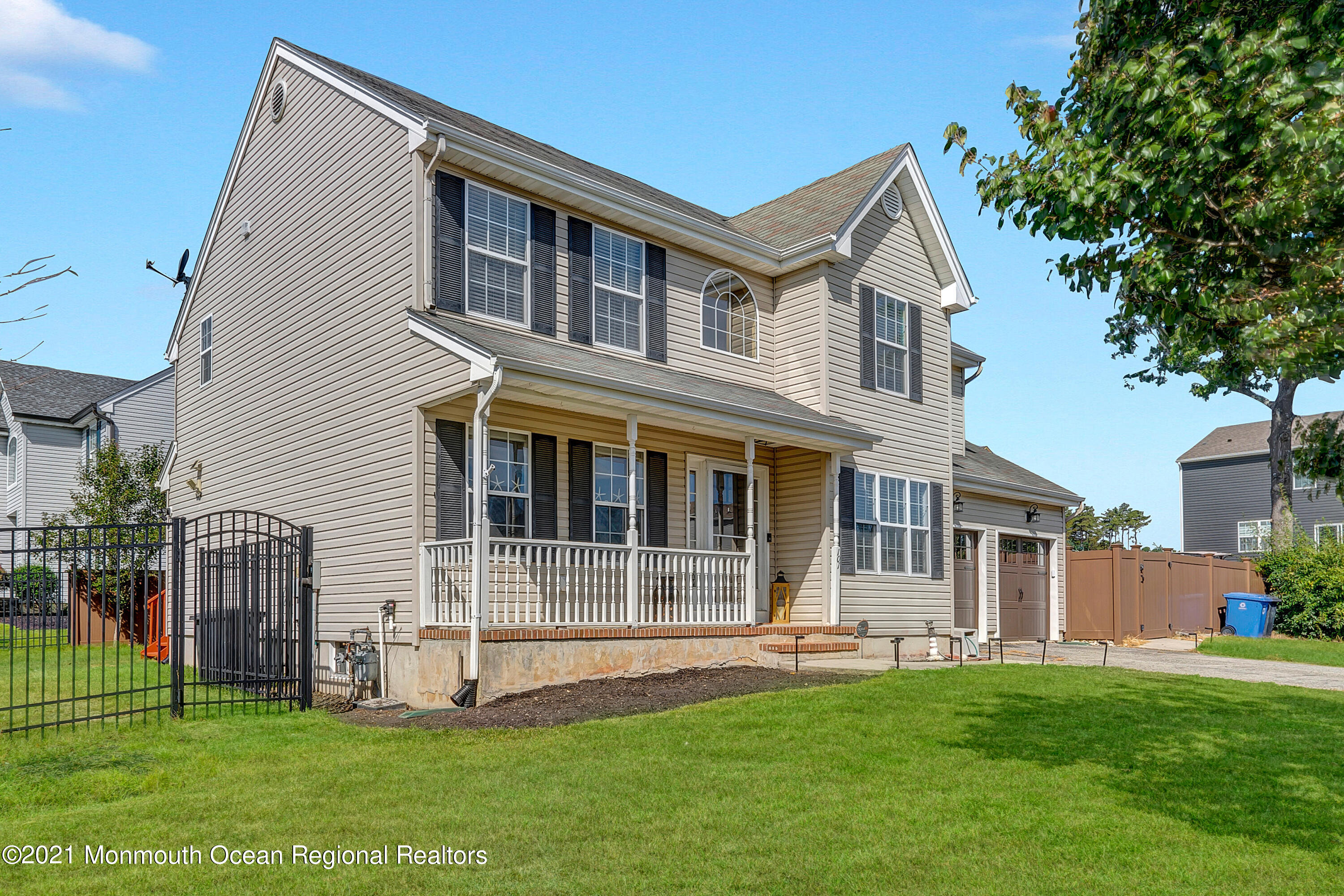 101 Longboat Road Manahawkin, NJ 08050 - Photo 43 of 47 a front view of a house with a yard