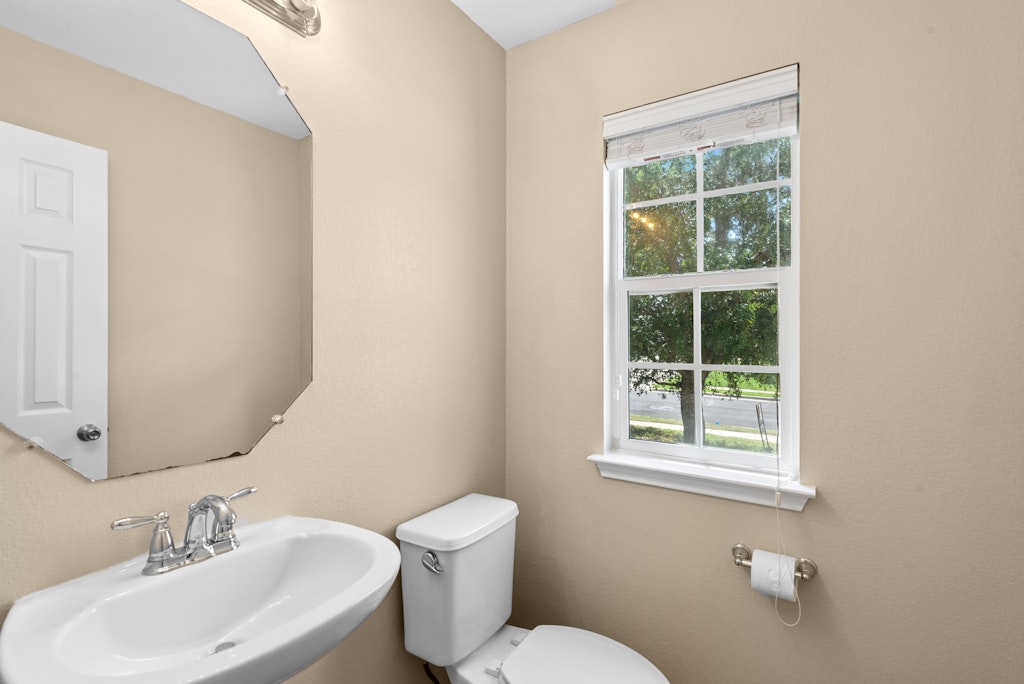 458 Nottingham Loop Kyle, TX 78640 - Photo 18 of 38 a bathroom with a toilet sink and mirror