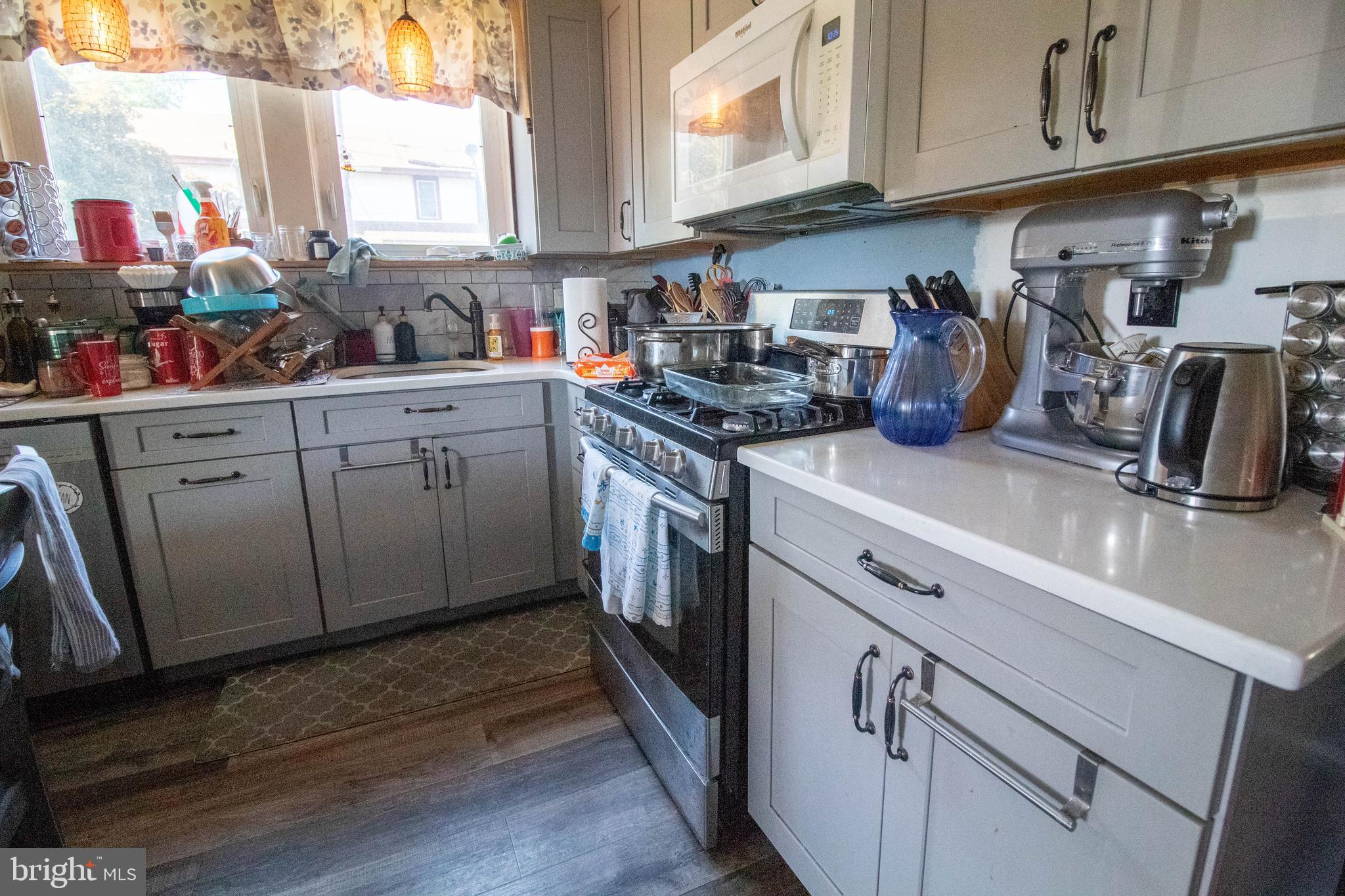 100 Grant Street Riverside, NJ 08075 - Photo 15 of 34 a kitchen with stainless steel appliances granite countertop a sink a stove and cabinets