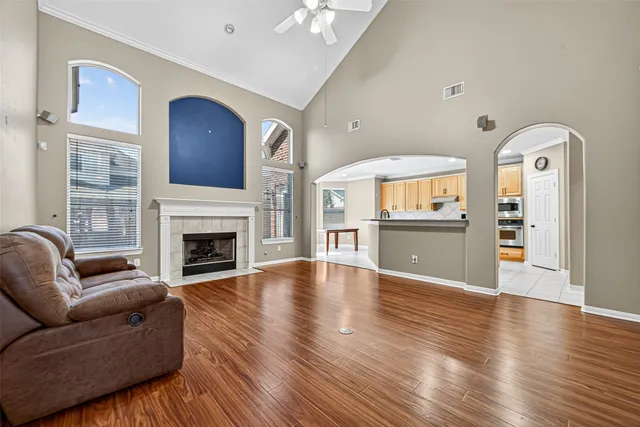 a living room with furniture and a fireplace
