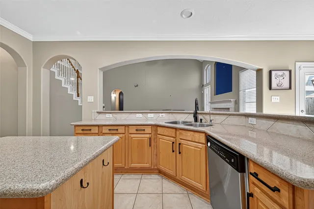 a kitchen with stainless steel appliances granite countertop a sink and cabinets