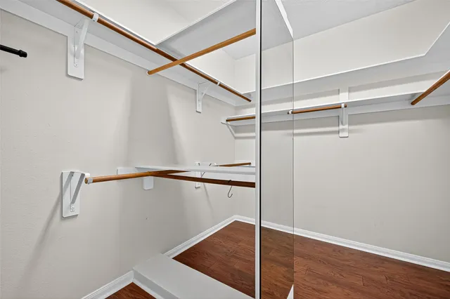 a view of an empty walk in closet