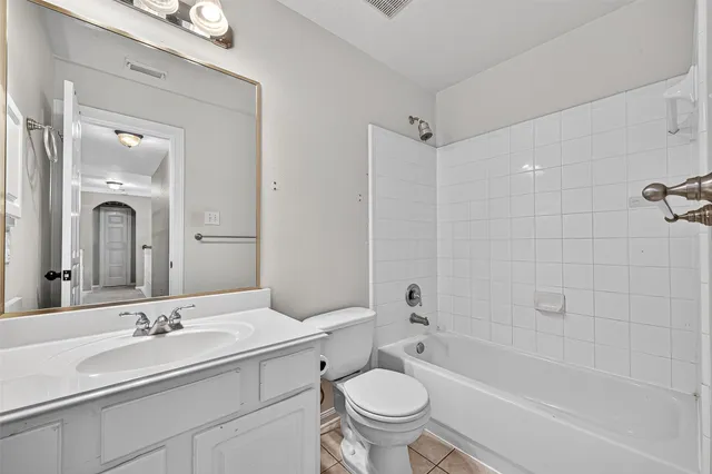 a bathroom with a sink toilet a mirror and shower