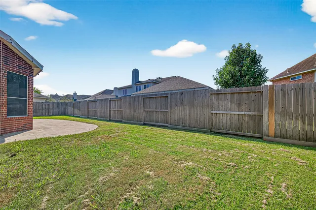 a view of a backyard with a trampoline