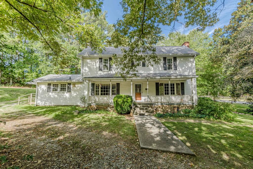 8167 Berea Road Winston, GA 30187 - Photo 1 of 1 a front view of a house with garden